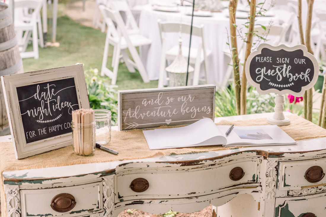 white table with date night ideas guest book
