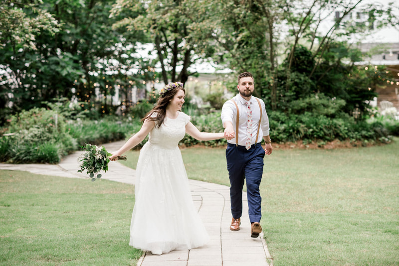 bride and groom walking pathway together