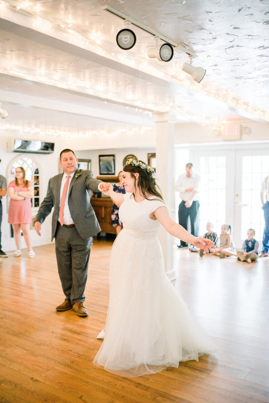 bride and father's first dance in carriage house